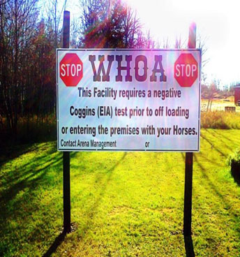 A biosecurity sign that has been posted in a field. Description follows.