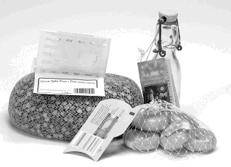 ornamental bottle, waxed-encased small cheeses and foil-wrapped milk chocolate in a mesh bag